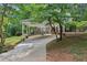Covered carport with ample parking and a landscaped yard at 5622 Williamsburg Dr, Norcross, GA 30093