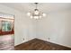 Formal dining room with hardwood floors and a chandelier at 5622 Williamsburg Dr, Norcross, GA 30093