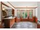 Spacious dining area with wood walls and hardwood floors at 5622 Williamsburg Dr, Norcross, GA 30093