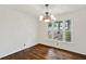 Dining room with hardwood floors and a chandelier, offering elegance at 5622 Williamsburg Dr, Norcross, GA 30093