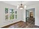Bright dining room with hardwood floors and view to backyard at 5622 Williamsburg Dr, Norcross, GA 30093