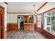 Open dining room with wood paneling and hardwood floors at 5622 Williamsburg Dr, Norcross, GA 30093