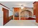 Kitchen with brick accent wall and wood cabinets at 5622 Williamsburg Dr, Norcross, GA 30093