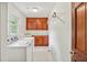 Bright laundry room with built in cabinets at 5622 Williamsburg Dr, Norcross, GA 30093