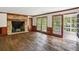 Living room with hardwood floors, fireplace and access to the patio at 5622 Williamsburg Dr, Norcross, GA 30093