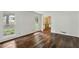 Bright living room with hardwood floors and access to other rooms at 5622 Williamsburg Dr, Norcross, GA 30093