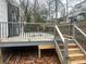 Exterior shot of the back deck with metal railings and new lumber support at 115 Montgomery St, Atlanta, GA 30317