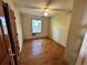 Bedroom featuring hardwood floors and a single window at 115 Montgomery St, Atlanta, GA 30317