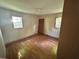 Bedroom featuring hardwood floors and two windows at 115 Montgomery St, Atlanta, GA 30317