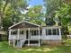 Quaint one-story home featuring a classic front porch with a traditional design at 115 Montgomery St, Atlanta, GA 30317