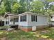 Exterior view of home with wood siding and black shutters at 115 Montgomery St, Atlanta, GA 30317