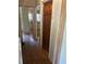Hallway with hardwood floors and wood trim on doorways at 115 Montgomery St, Atlanta, GA 30317