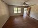 Large living room with wood floors ready for updating, awaiting your personal touch at 115 Montgomery St, Atlanta, GA 30317