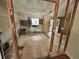 Incomplete room showing exposed studs and unfinished flooring, awaiting renovation at 115 Montgomery St, Atlanta, GA 30317