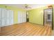 Spacious bedroom with laminate flooring, closet space, and en suite bathroom at 112 Camelot Dr, Atlanta, GA 30349