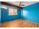Bedroom featuring laminate flooring, and a bright window at 112 Camelot Dr, Atlanta, GA 30349
