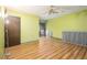 Bedroom showcasing wood-look flooring and ample space, with door leading to a balcony at 112 Camelot Dr, Atlanta, GA 30349