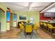 Dining room featuring a modern table and chairs, with adjacent kitchen and colorful design at 112 Camelot Dr, Atlanta, GA 30349