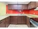 Standard kitchen area with laminate countertops, sink, and wood cabinets at 112 Camelot Dr, Atlanta, GA 30349