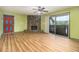The living room features wood floors, a stone fireplace, and sliding glass doors to a balcony at 112 Camelot Dr, Atlanta, GA 30349