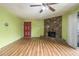 The living room features wood floors, a stone fireplace, and a bright red door at 112 Camelot Dr, Atlanta, GA 30349