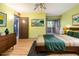 Bedroom with sliding glass doors to balcony, wood dresser, and a comfortable bed at 112 Camelot Dr, Atlanta, GA 30349