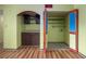 Features a walk-in pantry with bi-fold doors, shelving, and laminate floors at 112 Camelot Dr, Atlanta, GA 30349