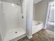 This bathroom includes a walk-in shower and separate tub at 4337 Ben Hill Rd, Atlanta, GA 30349
