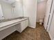 This bathroom features granite counters, tiled floors, and updated fixtures at 4337 Ben Hill Rd, Atlanta, GA 30349