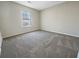 This inviting bedroom showcases soft carpeting and a bright window for comfort at 4337 Ben Hill Rd, Atlanta, GA 30349
