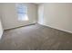 This cozy bedroom offers plush carpeting and a sunlit window for a tranquil atmosphere at 4337 Ben Hill Rd, Atlanta, GA 30349
