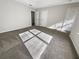 This bedroom features neutral walls, soft carpet, and natural light; it offers a calming space at 4337 Ben Hill Rd, Atlanta, GA 30349