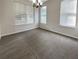 An empty dining room with chandelier at 4337 Ben Hill Rd, Atlanta, GA 30349