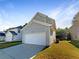 The home boasts gray siding, a two-car garage, and a well-maintained yard at 4337 Ben Hill Rd, Atlanta, GA 30349