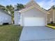 The exterior offers a two-car garage, neutral siding, and a manicured lawn at 4337 Ben Hill Rd, Atlanta, GA 30349