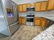 Well-equipped kitchen with stainless steel appliances and granite countertops at 4337 Ben Hill Rd, Atlanta, GA 30349