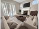 Inviting living room featuring ample seating, a fireplace, and neutral decor at 4337 Ben Hill Rd, Atlanta, GA 30349