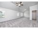 Spacious main bedroom with ceiling fan and carpet flooring at 581 Hancock Dr, Atlanta, GA 30354