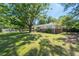 Traditional home with a sprawling front yard, showcasing mature trees and a well-maintained lawn at 2785 Toney Dr, Decatur, GA 30032