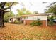 Brick ranch home with a yard covered in fall leaves at 2785 Toney Dr, Decatur, GA 30032