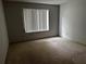 Simple bedroom with a window and carpeted floor at 17 Fair Haven Se Way, Smyrna, GA 30080