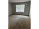 Bright bedroom featuring a large window and wall-to-wall carpeting at 17 Fair Haven Se Way, Smyrna, GA 30080