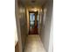 Light-filled hallway with tile floors and built-in storage closets at 17 Fair Haven Se Way, Smyrna, GA 30080