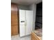 White refrigerator and corner pantry in kitchen at 17 Fair Haven Se Way, Smyrna, GA 30080