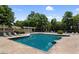 Refreshing community pool with lounge chairs and shade structures at 17 Fair Haven Se Way, Smyrna, GA 30080