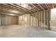 Unfinished basement with framed walls and exposed utilities at 939 Jean Ct, Covington, GA 30014