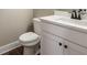 Modern bathroom with white vanity and black matte faucet at 939 Jean Ct, Covington, GA 30014