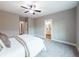 Charming bedroom with en-suite bathroom access and ceiling fan at 939 Jean Ct, Covington, GA 30014