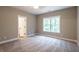 Spacious bedroom with carpeted floor and large window at 939 Jean Ct, Covington, GA 30014