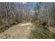 Serene view of the creek flowing through a beautiful, wooded area on the property at 939 Jean Ct, Covington, GA 30014